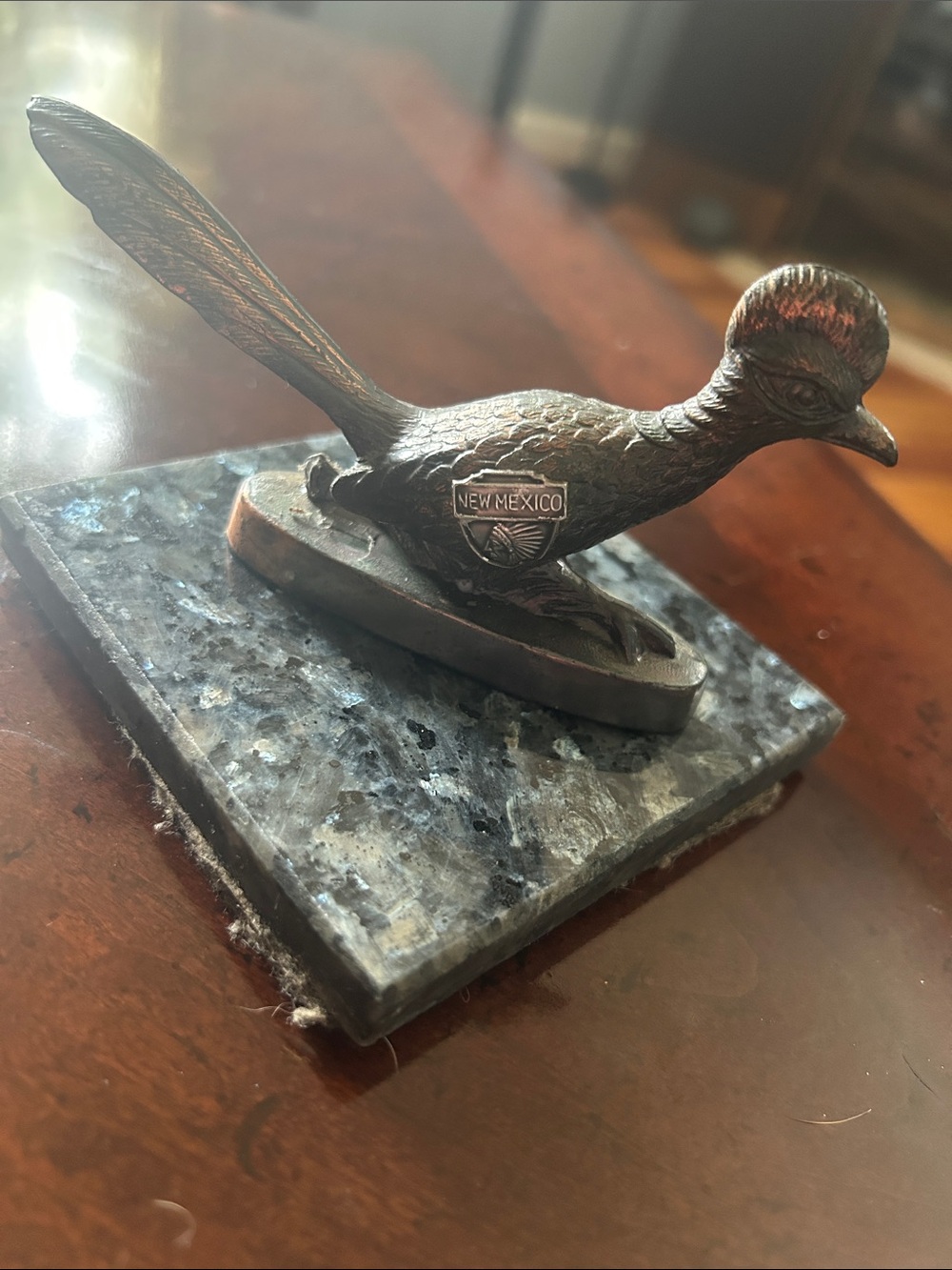 Vintage 1960s Peuter New Mexico State emblem road runner paperweight.